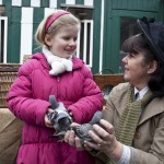 Helen Power of the North East Homing Union pigeon fanciers shows five-year-old Sophie Campbell of Sunderland a pair of pigeons during a demonstration of historical past times at Beamish Museum in County Durham. The event was part of the national Museums at Night, late-night-opening programme